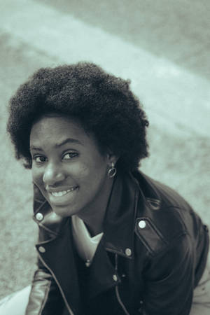 4k Black Woman In Leather Jacket Wallpaper