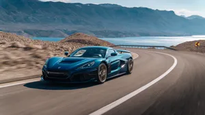 4k Blue Car Driving On Road Wallpaper