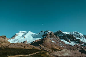 4k Flat Wallpapaer Of The Ice-capped Brown Mountains Wallpaper