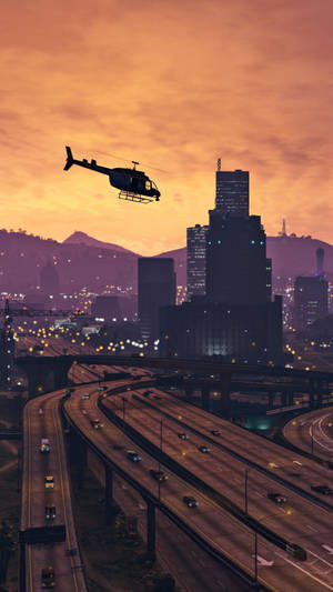 4k Gta 5 Helicopter Over Los Santos Wallpaper