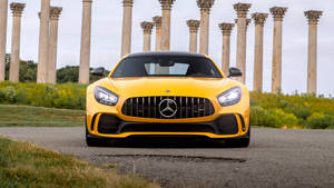 4k Mercedes Yellow With Concrete Post Wallpaper