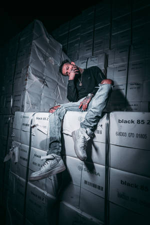 4k Resting Man Nike Shoe Boxes Wallpaper