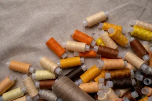 4k Tablet Yellow Thread Spools Wallpaper