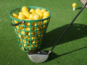 4k Yellow Golf Balls Inside Basket Wallpaper