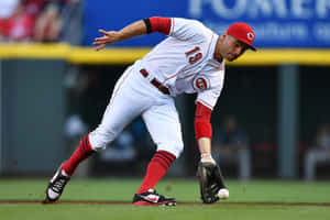 A Baseball Player Is Catching A Ball Wallpaper