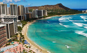 A Beach With A Lot Of People And Buildings Wallpaper