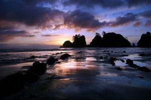 A Beach With Rocks Wallpaper