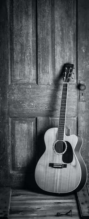 A Beautiful Acoustic Guitar, Perfect For Getting Creative! Wallpaper