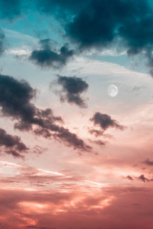 A Beautiful Sunset View Of The Clouds In Golden Hour Wallpaper