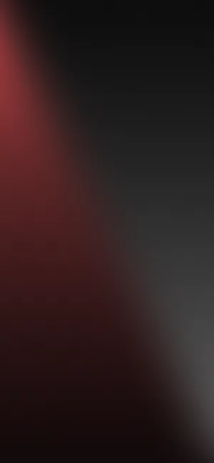 A Black And Red Background With A Light Shining On It Wallpaper