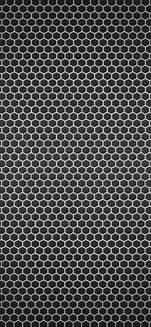 A Black And White Hexagonal Pattern On A Black Background Wallpaper