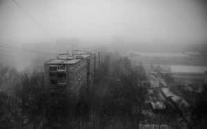 A Black And White Photo Of A City In The Snow Wallpaper