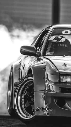 A Black And White Photo Of A Drift Car Wallpaper