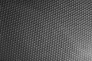 A Black And White Photo Of A Metal Surface Wallpaper