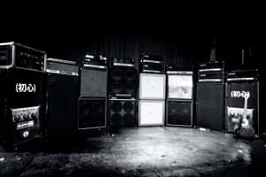 A Black And White Photo Of Several Amps In A Room Wallpaper