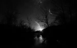 A Black And White Photo Of The Moon And Stars Wallpaper