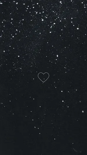 A Black Background With A Heart In The Sky Wallpaper