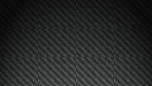 A Black Background With A Light Texture Wallpaper