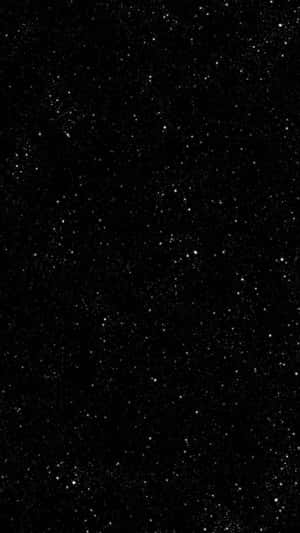 A Black Background With Stars On It Wallpaper
