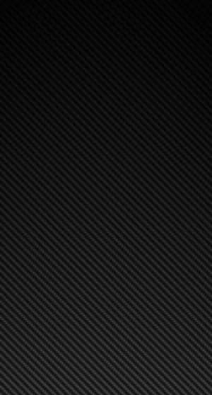 A Black Carbon Fiber Background With A Black Background Wallpaper