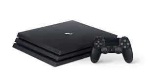 A Black Playstation 4 Console With Two Controllers Wallpaper