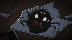 A Black Spider Is Sitting On A Piece Of Paper Wallpaper