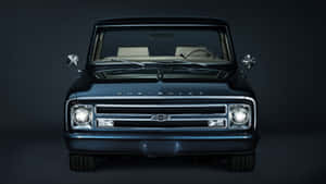 A Black Truck With A Black Front End Wallpaper