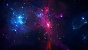 A Blue And Purple Space With Stars And Nebulas Wallpaper