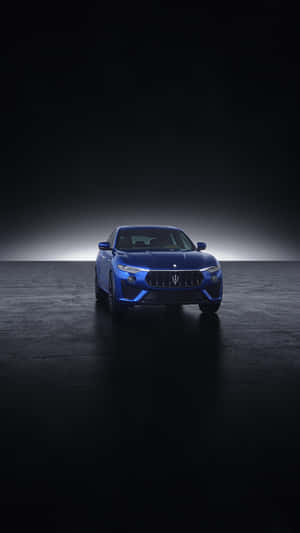 A Blue Car Poised For Its Next Adventure Wallpaper