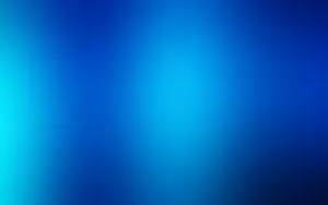 A Blue Desktop Illuminated With Natural Light Wallpaper