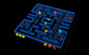 A Blue Pac-man Game With A Blue Background Wallpaper
