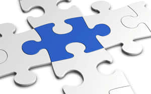 A Blue Puzzle Piece With A Missing Piece Wallpaper