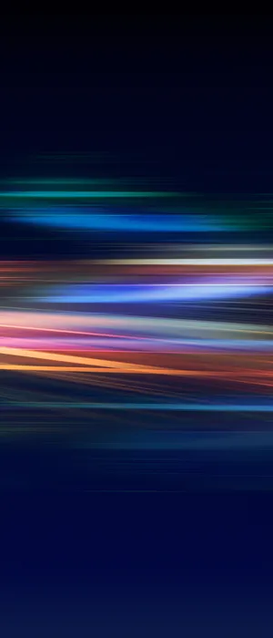 A Blurred Background With Colorful Lights Wallpaper