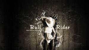 A Bold Bull Rider Gearing Up For The Next Challenge Wallpaper