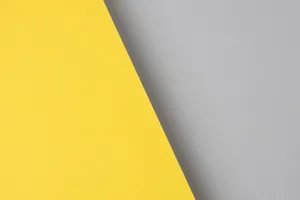 A Bright Gray And Yellow Background Wallpaper