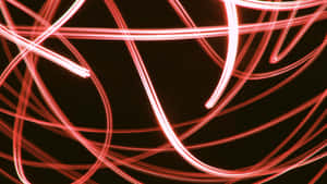 A Brilliant Light Red Glowing Red In The Darkness Wallpaper