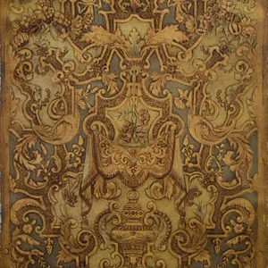 A Brown And Gold Tapestry With Ornate Designs Wallpaper