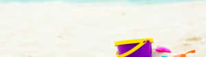 A Bucket And A Sandcastle In The Sand Wallpaper