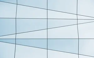 A Building With A Blue And White Glass Wall Wallpaper