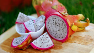 A Burst Of Exotic Flavor - Fresh, Sliced Dragonfruit Wallpaper