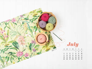 A Calendar With A Flower Pattern And Yarn Wallpaper