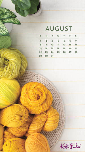 A Calendar With Yarn And A Plant Wallpaper