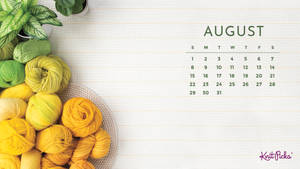 A Calendar With Yarn And A Plant Wallpaper