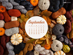 A Calendar With Yarn And Pumpkins Wallpaper