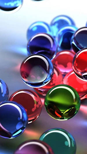 A Captivating View Of Colorful 3d Transparent Balls Wallpaper