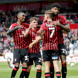 A Cherished Team Moment - Afc Bournemouth Group Hug Wallpaper