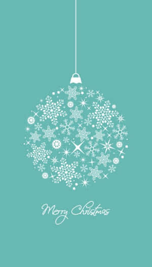A Christmas Ball With Snowflakes On A Turquoise Background Wallpaper