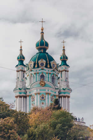A Church With A Green Dome On Top Of It Wallpaper