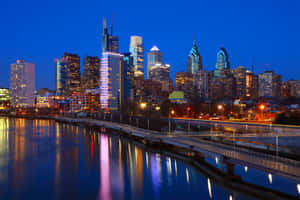 A City Skyline At Night Wallpaper