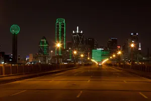 A City Skyline At Night Wallpaper